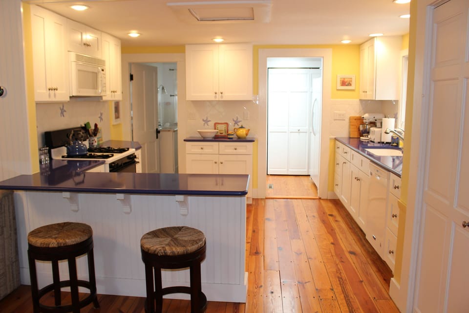 New Kitchen with quartz counters and handmade starfish tiles