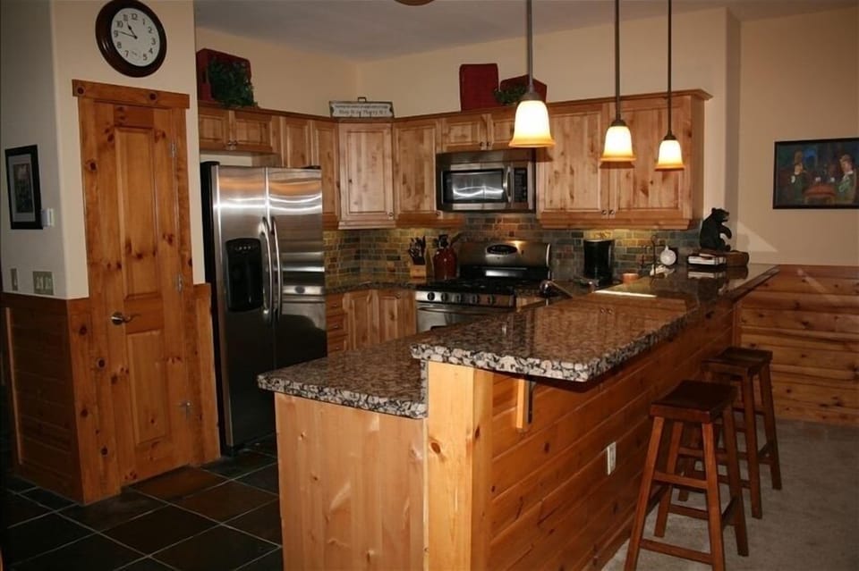 Kitchen - Stocked with quality pots, pans, dinnerware and kitchen tools