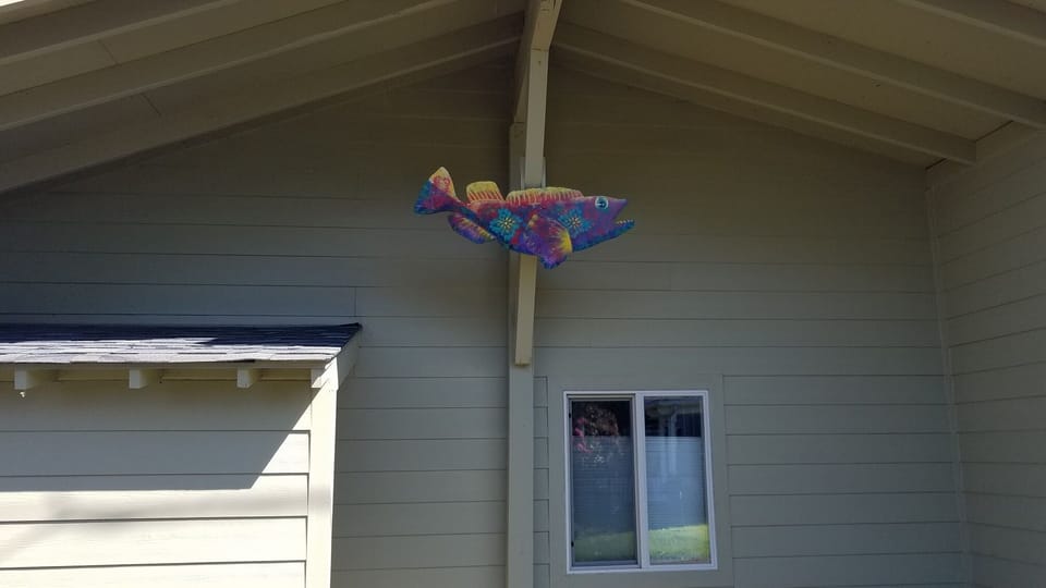 Our mascot "Ling Cod Almighty" roadside of the cabin. 