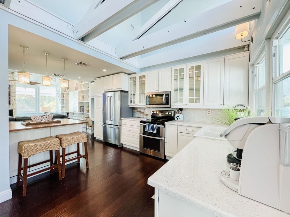 Fully equipped kitchen with pots, pans . utensils and much more.