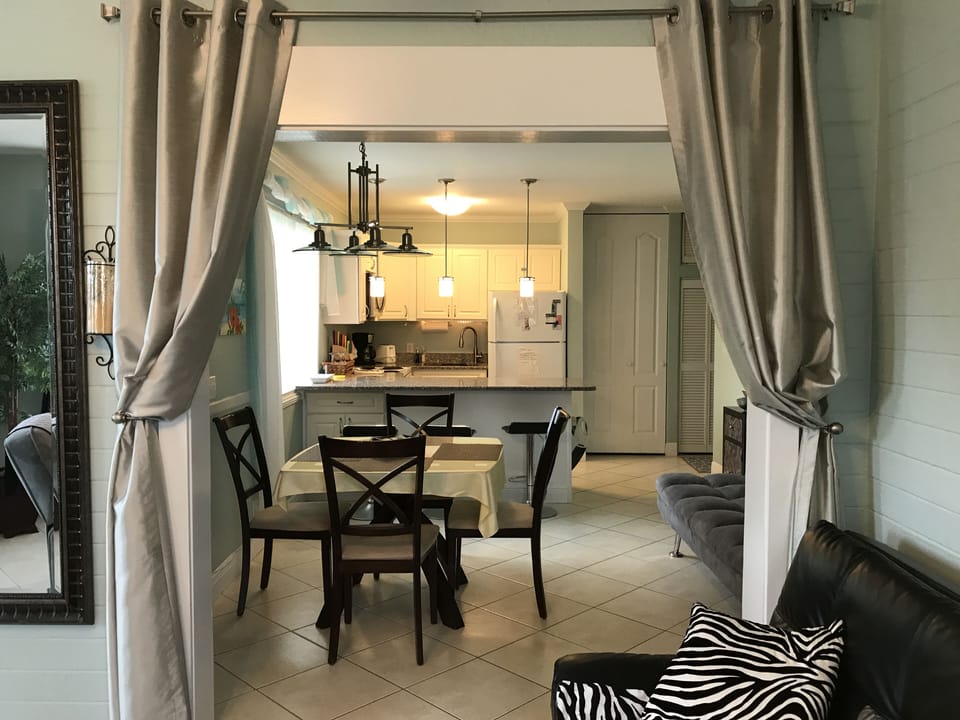 Large Unit#2 View from Fam. room to Kitchen and Liv. room-Curtains for privacy