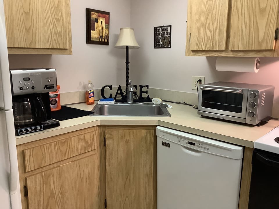 Kitchen sink corner with convection oven/toaster and coffee maker.  K-cup too!