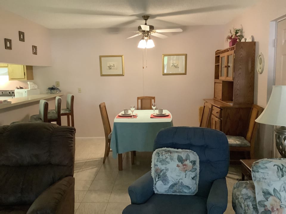 Updated fan (painted) w/newer couch, and re-upholstered chairs in fine fabrics.