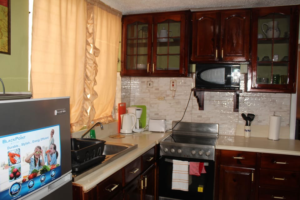 Fully-equipped kitchenette complete with microwave, coffee maker, toaster & more