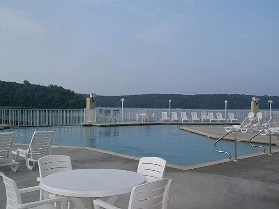 OUTDOOR POOL WITH WATERFALL AND PARK AND LAKE VIEW