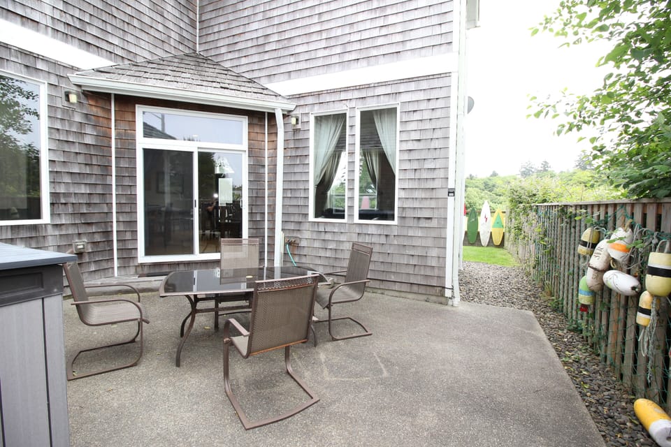 Side Patio. BBQ and fire pit are in the storage container.