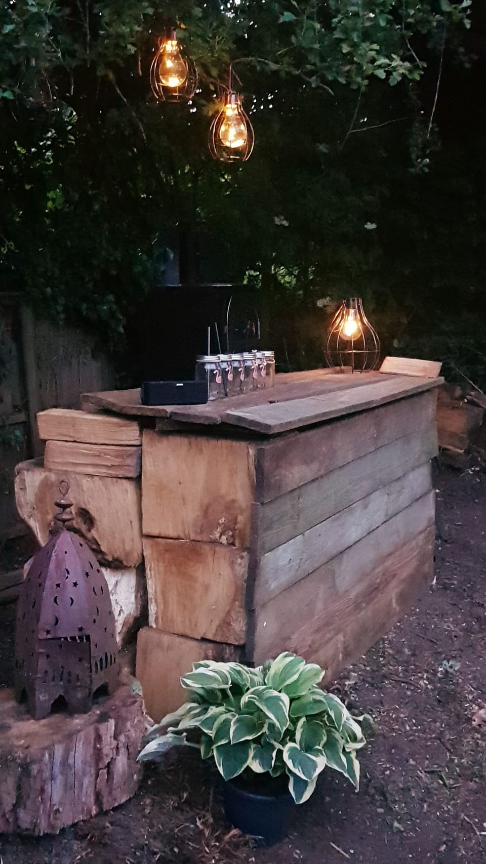Outdoor bar with fridge and pizza oven