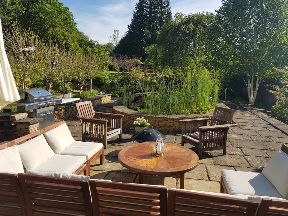 BBQ, firepit and outside seating next to the pond.