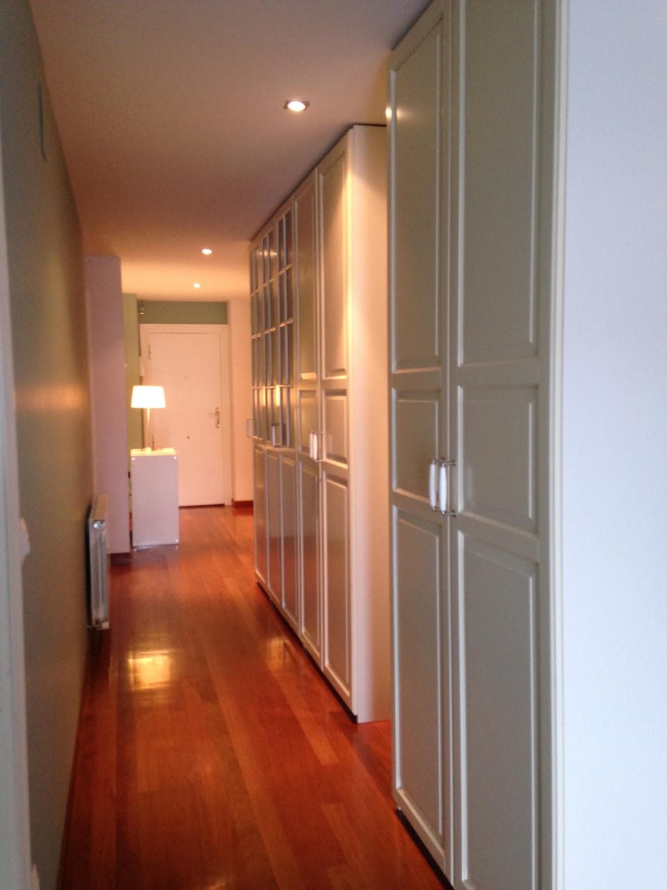 Hallway seen from the living room with wardrobes