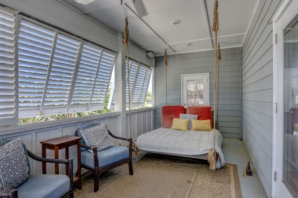 Covered Porch with swing daybed off kitchen.