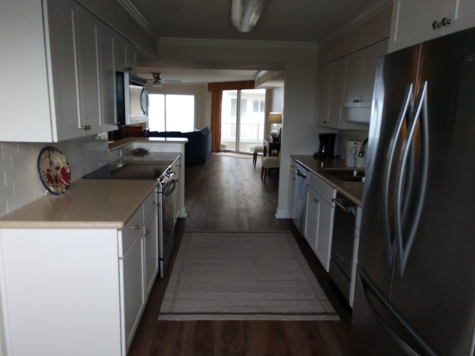 Kitchen looking into main living area & the Gulf 🏖️