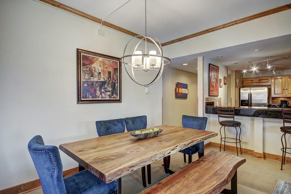 Plenty of seating at dining table and stools at breakfast bar