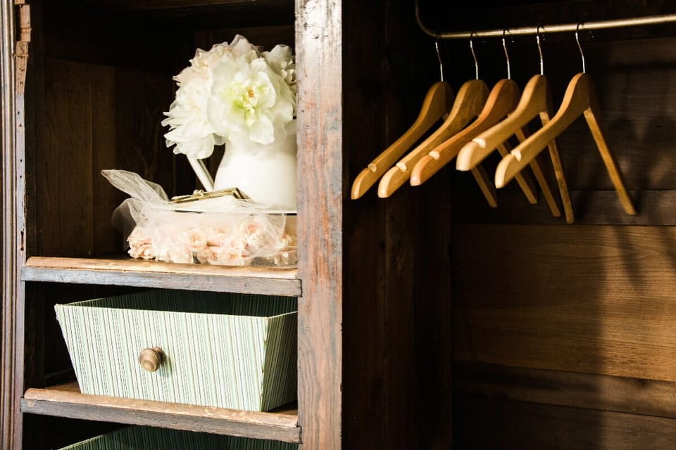 And a unique clothes storage cabinet lends to the vintage feel of the room.