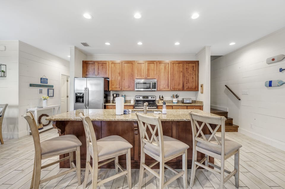 New kitchen with granite counters, and 4 barstools