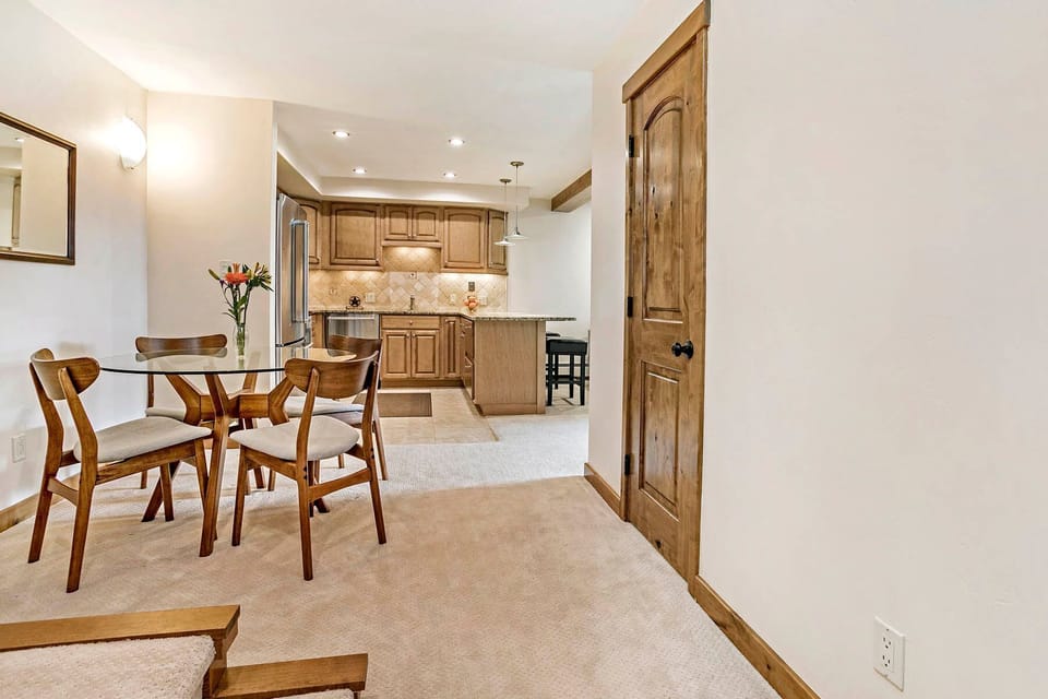 Entry opens to the charming dining area and kitchen with bar seating