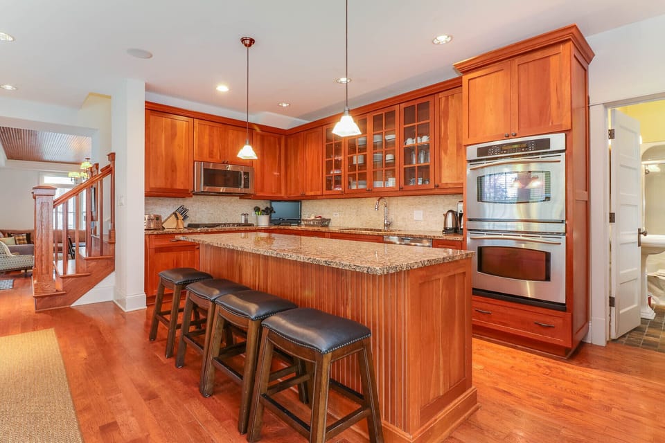 Solid cherry cabinets, natural granite counter tops, stainless steel appliances.