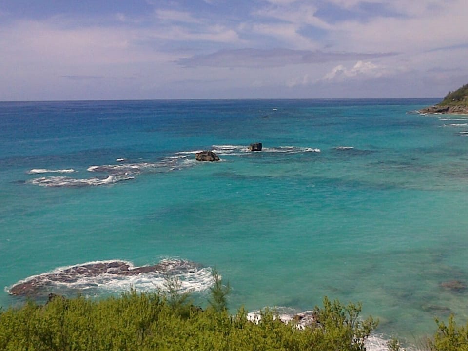 You can sit on the bench overlooking  Scenic Church Bay.. only a 2 min walk
