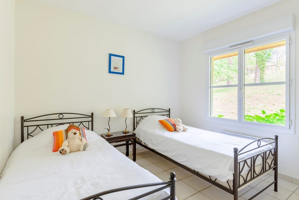 There are 2 single beds in the third bedroom.
