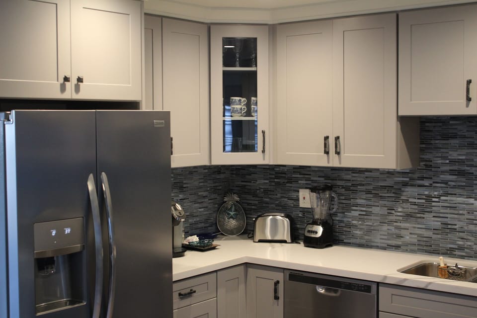 Brand new refrigerator with filtered cold water and ice cubes