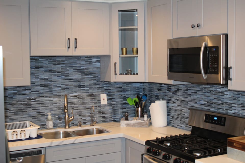 Completely brand new cabinets, back splash, microwave, countertops  and stove