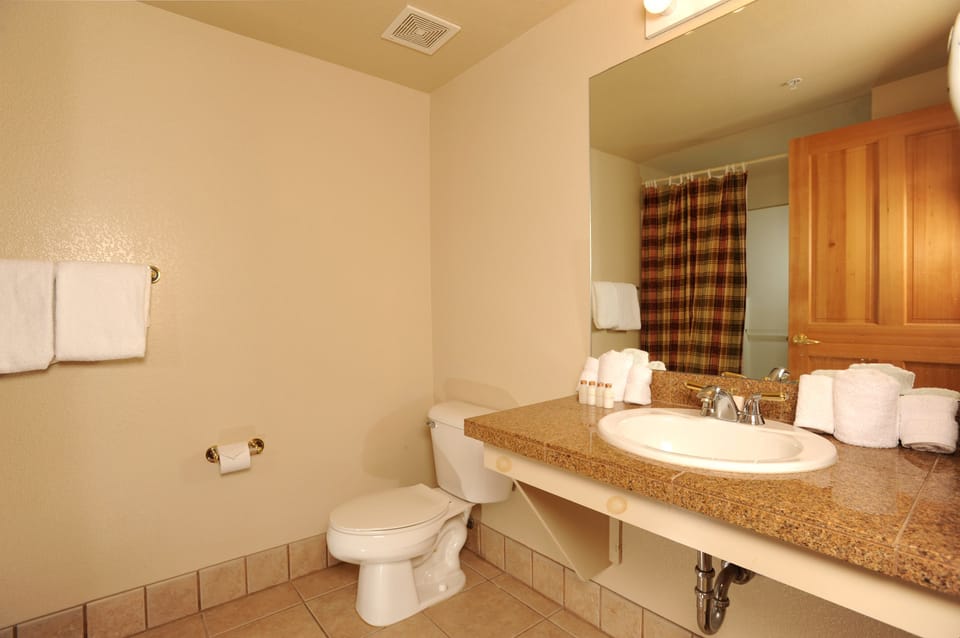 Get ready for the day ahead in the bright bathroom.
