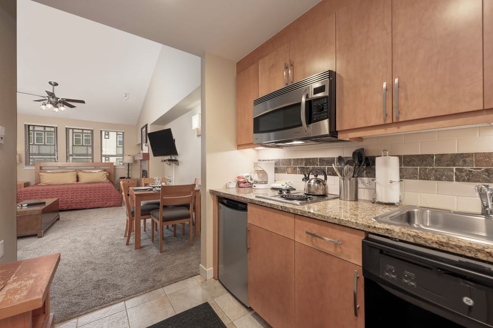 Your fully equipped kitchen features granite counters and stainless appliances, perfect for preparing meals during your stay.