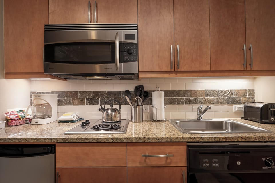 Your fully equipped kitchen features granite counters, stainless appliances, and everything you need to create memorable meals during your stay.