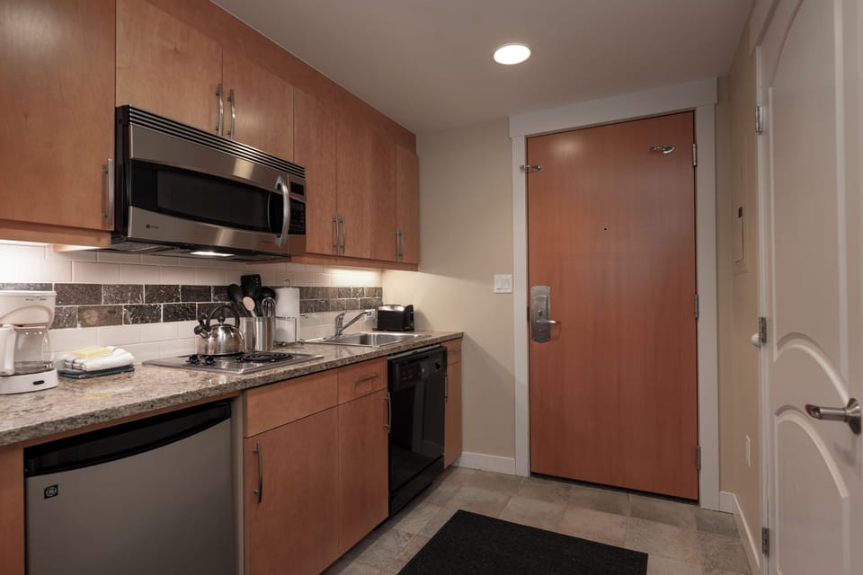 Your fully equipped kitchen awaits with granite counters, stainless appliances, and everything you need to create memorable meals during your stay.