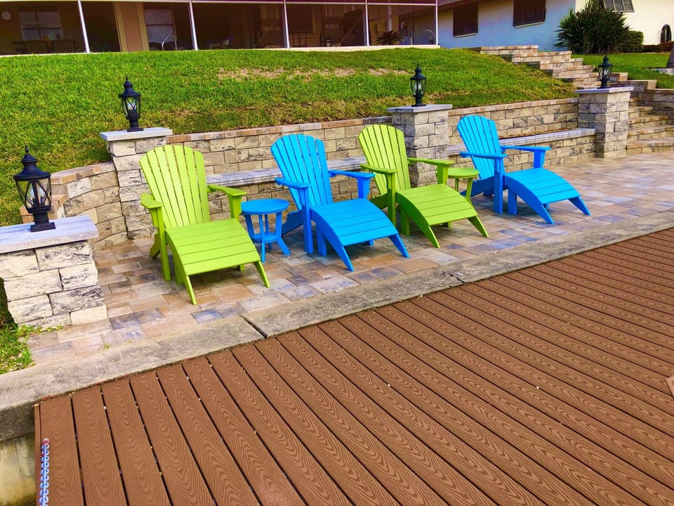 Sun bathe, watch the boats go by, from new Adirondack chairs with ottomans!
