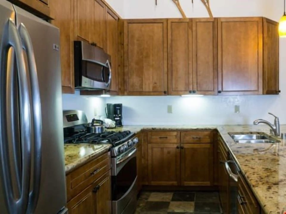 Prepare meals in the kitchen and take a seat at the breakfast bar.