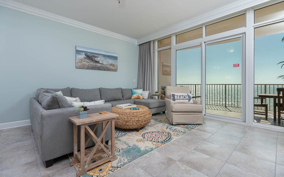 Relax in the spacious living area, enjoying the coastal views while sinking into the plush sofa with a queen sleeper