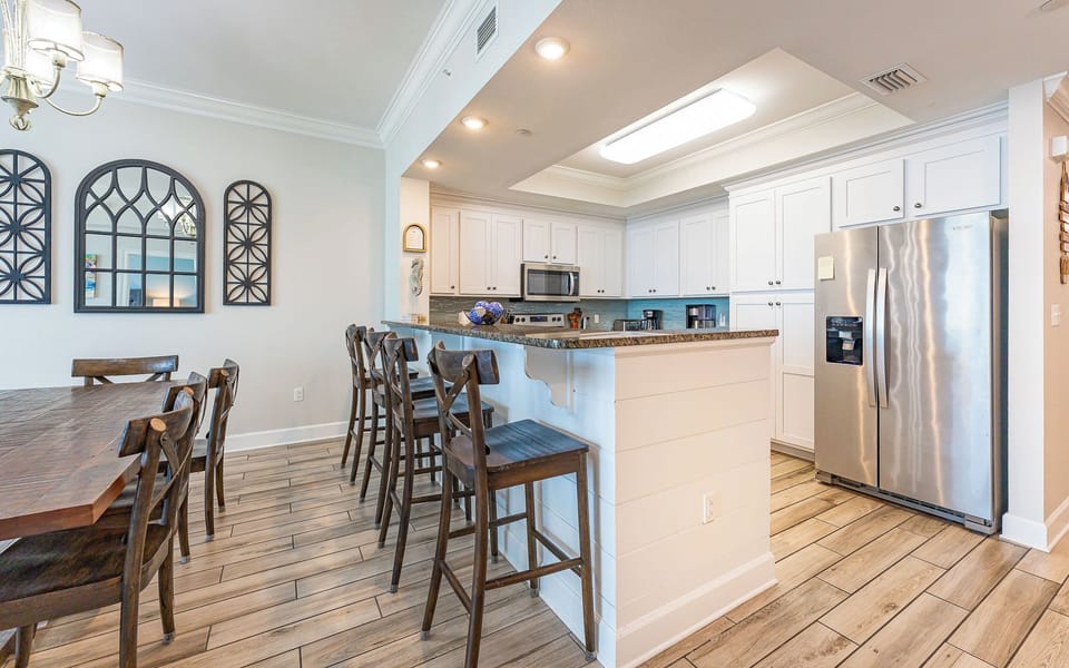 Wake up with morning coffee at the breakfast bar and get ready for a beach day in this stylish space