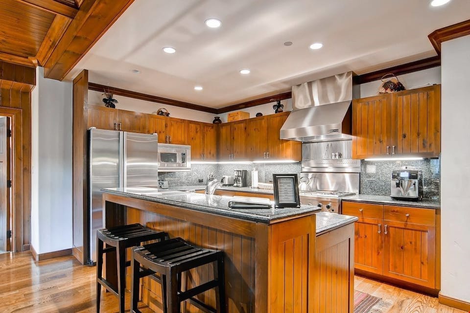 Granite countertops and updated appliances give a luxurious feel to the kitchen.