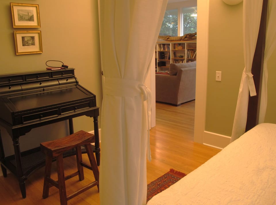 View to sitting area in living room from bedroom.