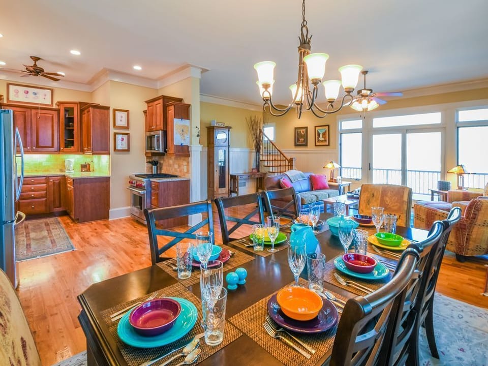 Dining area, main table very comfortablseating for 8, total 12 chairs available.