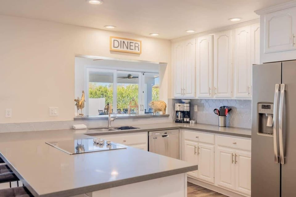 Whip up meals, enjoying lively indoor-outdoor connections.