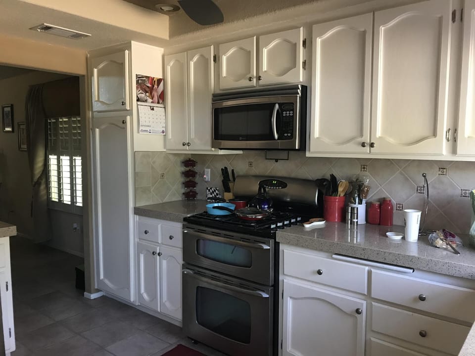 Kitchen with stainless steel appliances and quartz counters
