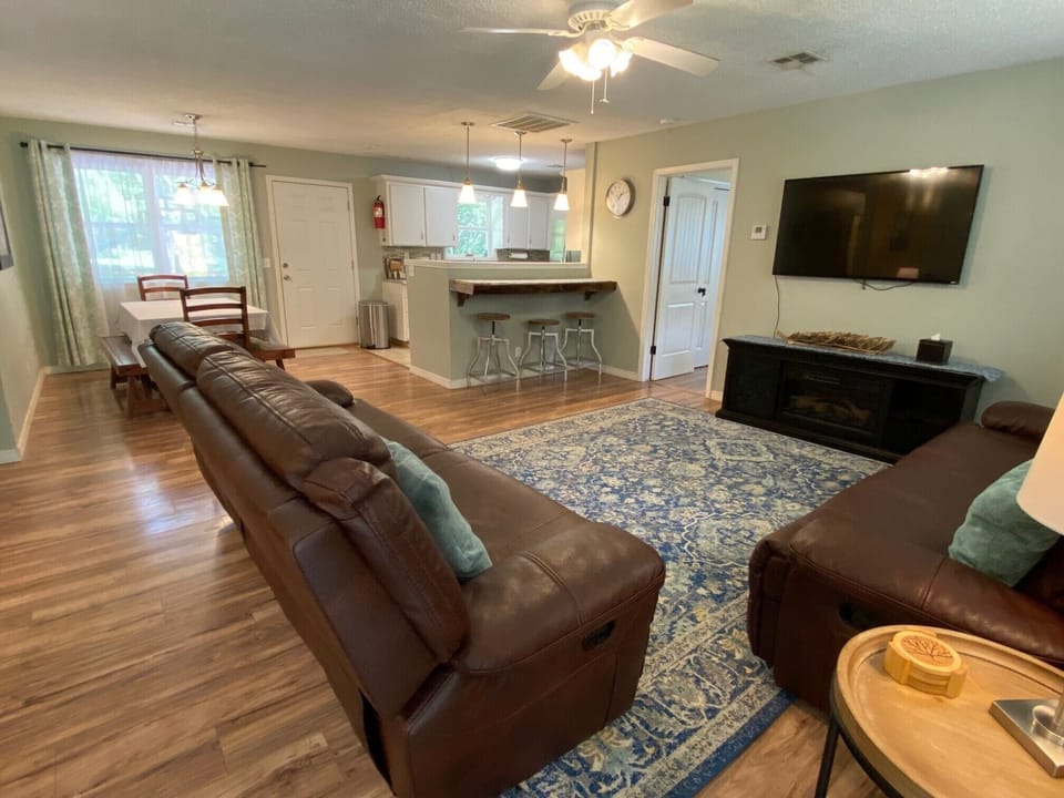 As you enter, living room leads to dining room and kitchen.