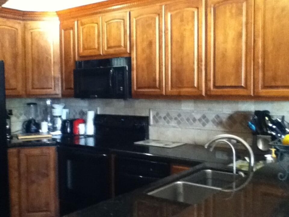 Kitchen with microwave, dishwasher, double sink and filtered water faucet