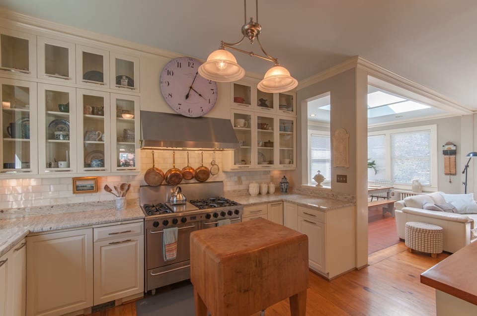 Gourmet kitchen with granite counters, fine French copperware