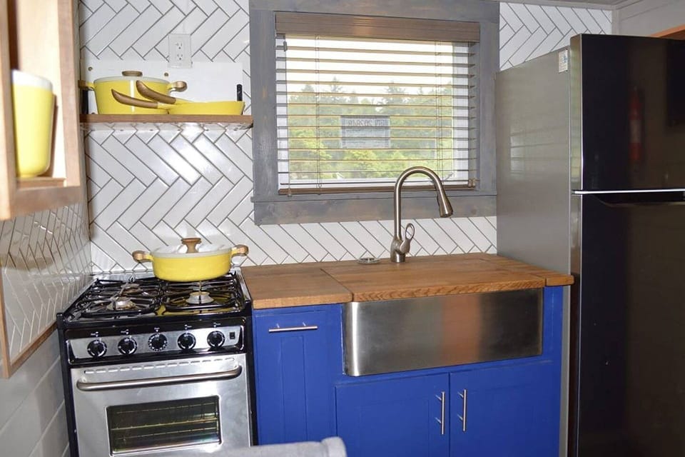 Kitchen with gas range and farmhouse sink