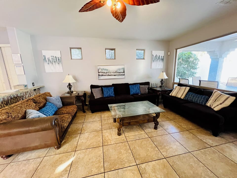Large Living room to gather together and enjoy the 85” Tv 