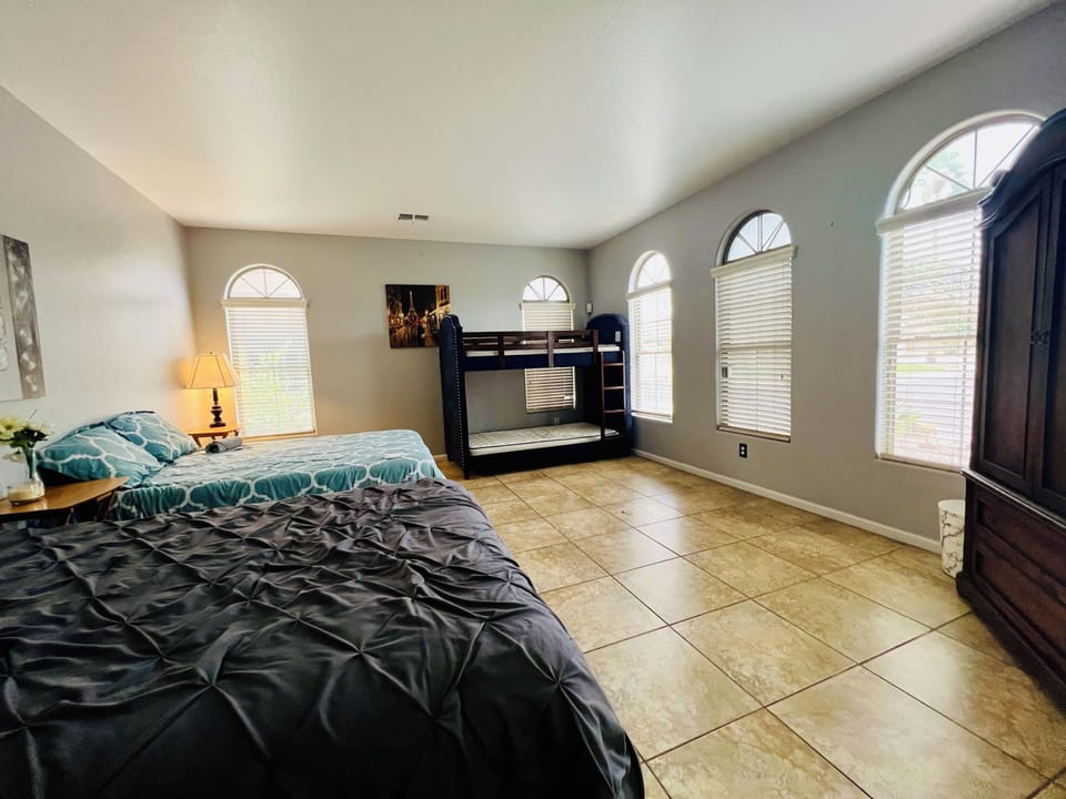 Downstairs Den converted to a family room with 2 queen beds & a twin bunk bed!