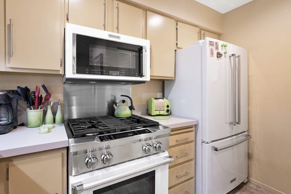 Kitchen with top of the line Kitchenaid commercial style gas range