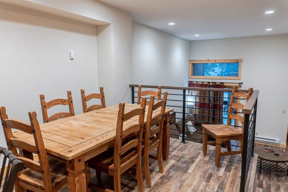 The dining table has seating for 6 with additional chairs available. The kitchen island with 4 barstools is directly behind the table providing plenty of seating for your group to enjoy each other's company while eating meals.