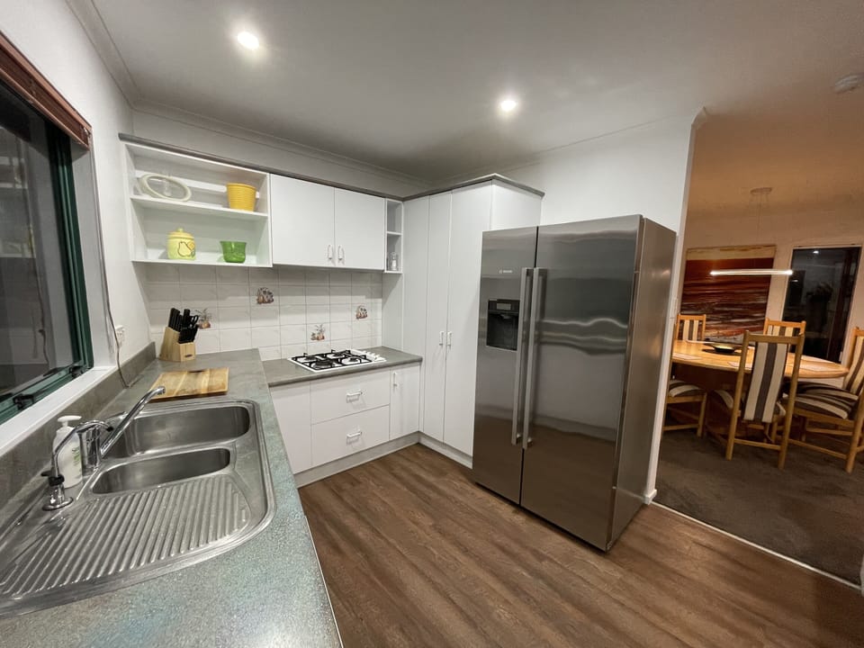 Kitchen with ice maker fridge

