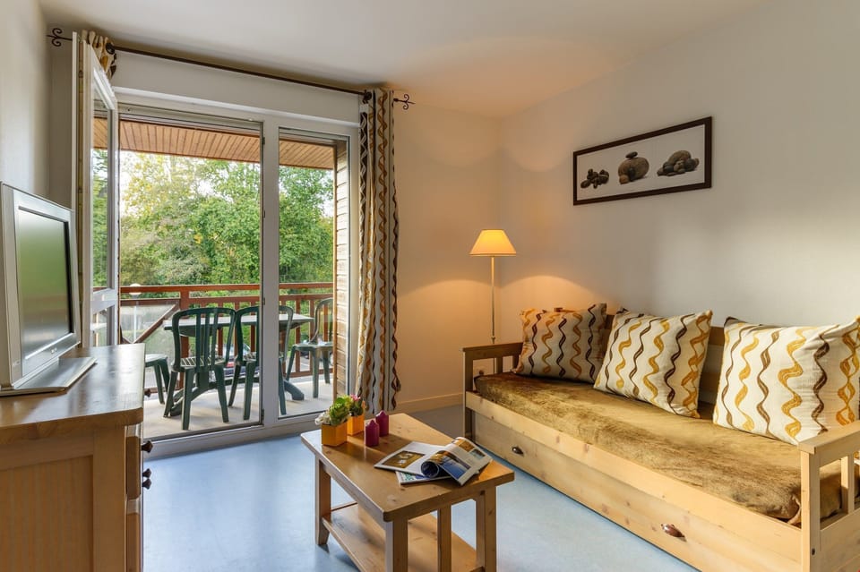 Find peace and relaxation with your close friends and family in this stunning open-concept living room featuring natural decor.