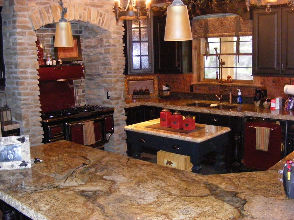 Large Kitchen with custom cabinetry, Heartland Rustic appliances and eating bar.
