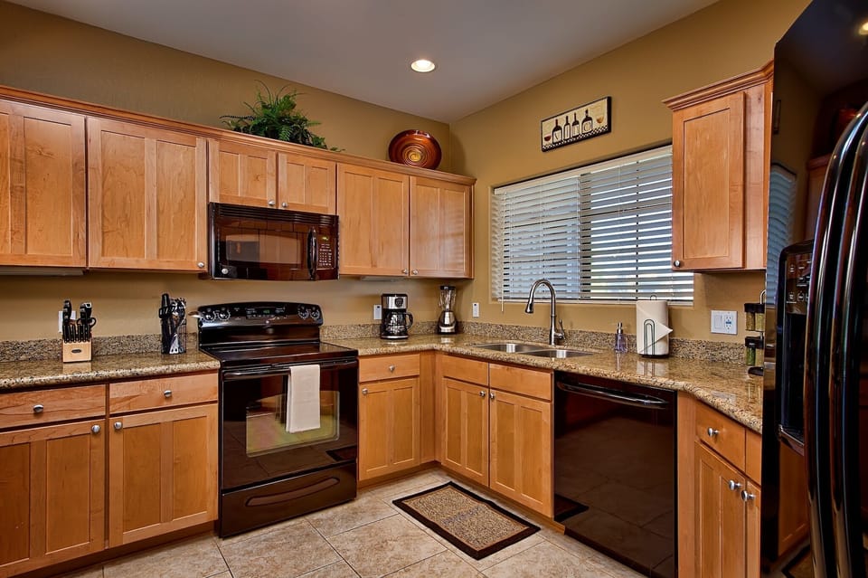 Spacious kitchen with granite counters.