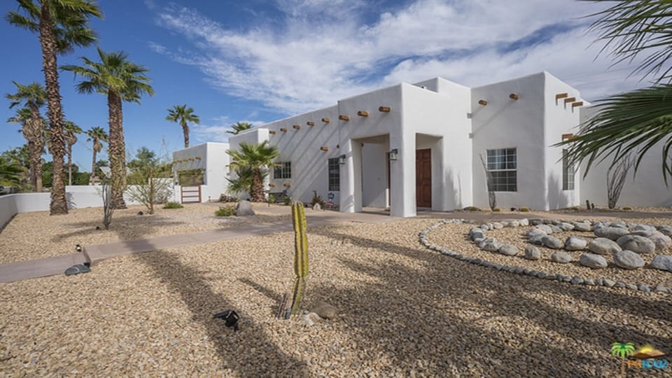 Succulents and mature palms throughout.